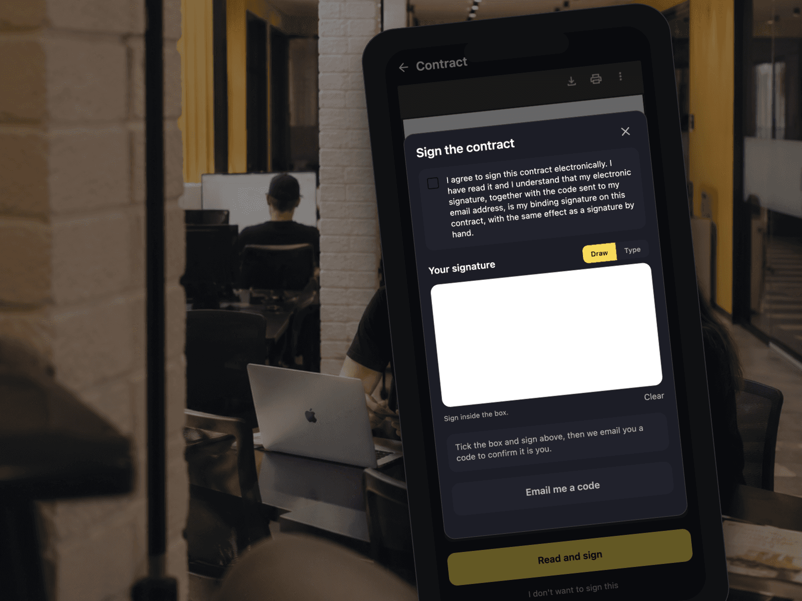 A phone in the open workspace showing the signing sheet in the member app