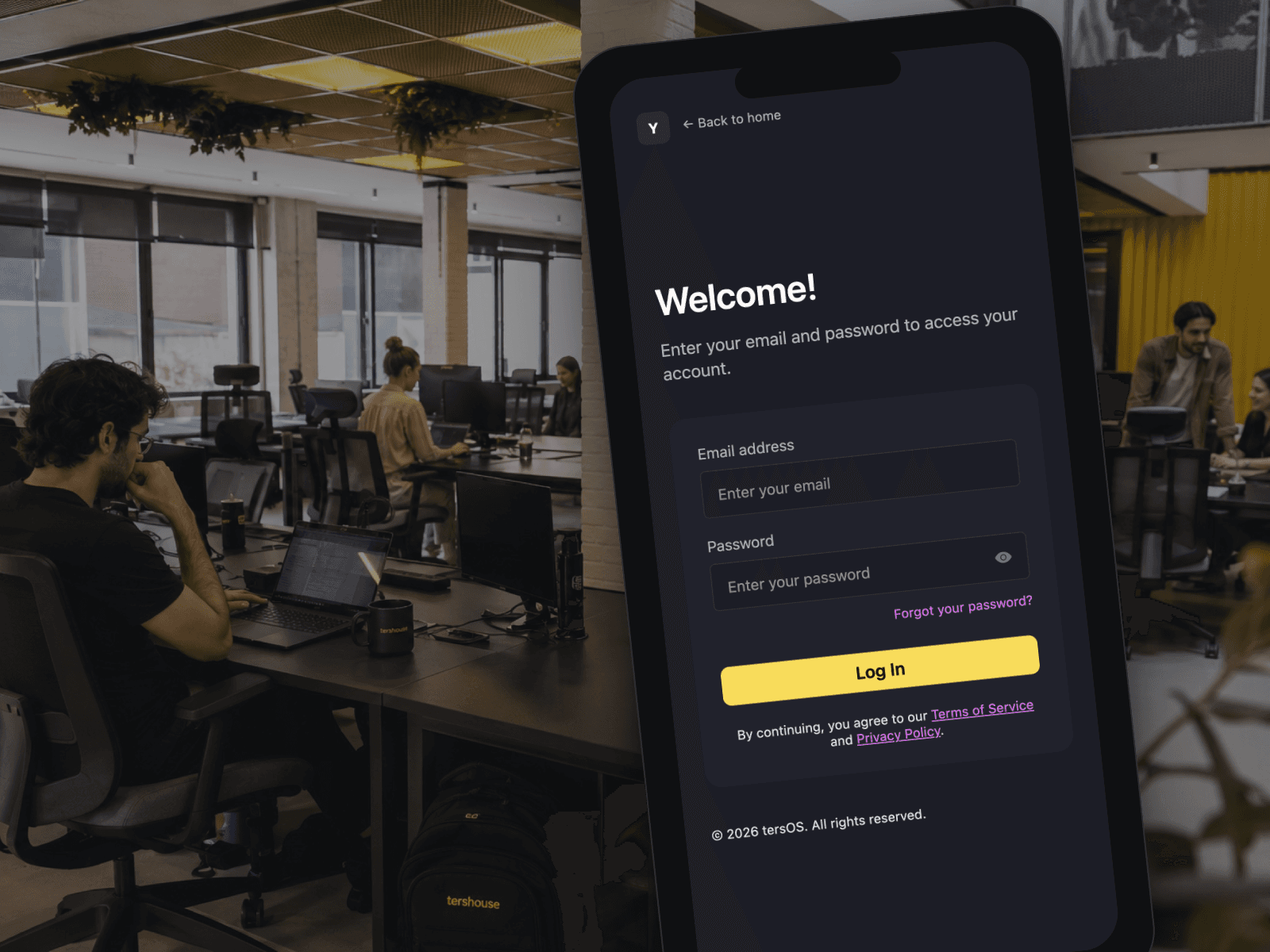 A phone in the open workspace showing the member app sign-in screen with the workspace mark